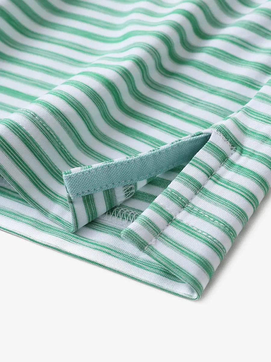 Close-up of hem slit detail on GREEN WHITE Unique Watercolour Stripe Polo