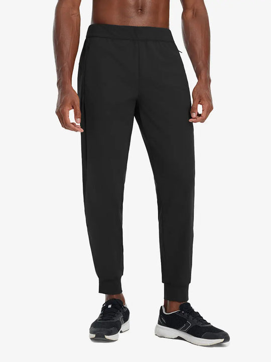 Front lower body view of model wearing BLACK Performance Tapered Sports Joggers