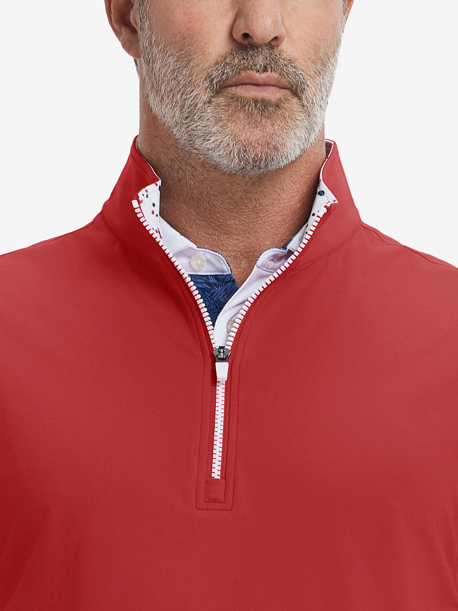 Close-up from nose to chest, showing collar detail and zipper of the red golf vest.