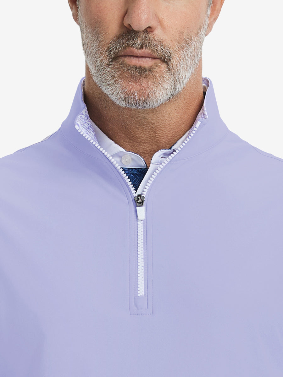 Close-up from nose to chest, showing collar detail and zipper of the lavender golf vest.