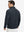 Back upper view of model in midweight warm stretchy quarter zip pullover, highlighting shoulder fit in navy.