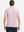 Back half-body view of model wearing LIGHT PINK STRIPE Stylish Performance Golf Polo