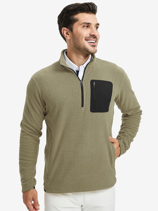 Model with one hand in side pocket, wearing midweight warm stretchy quarter zip pullover in desert yellow.
