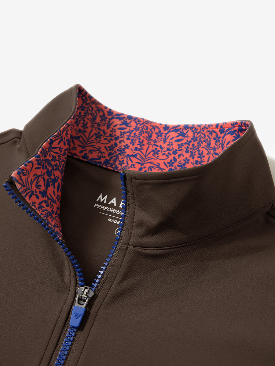 Zipper and inner pattern detail of the print collar quarter zip golf vest in coffee brown, highlighting design.