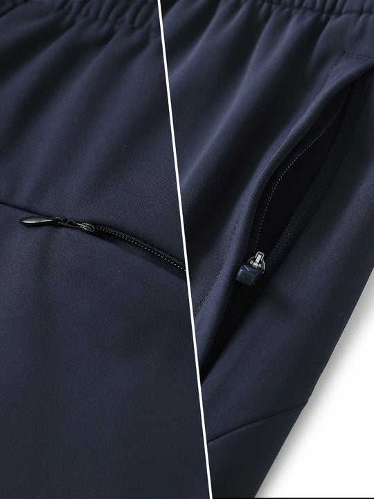 Two-part detail of lightweight women's stretchy joggers sweatpants zippers shown in navy.