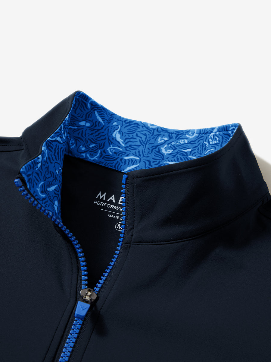 Zipper and inner pattern detail of the print collar quarter zip golf vest in navy, highlighting design.