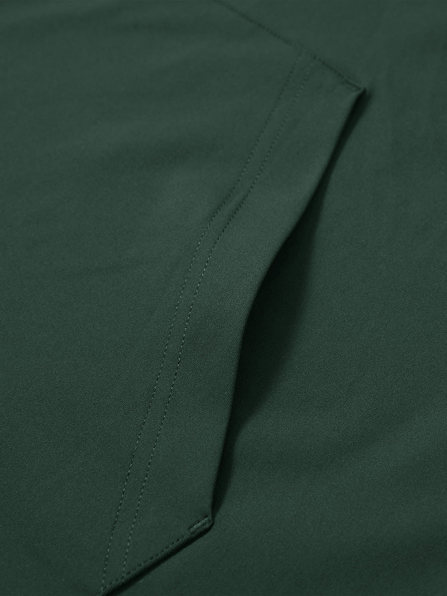 Close-up of single pocket detail on youth long sleeve hoodied with kangaroo pocket in forest green, showing stitching.