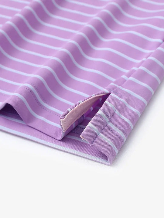 Hem slit detail of LILAC/LIGHT BLUE STRIPE Youth Performance Golf Polo highlighting stitching and finish.