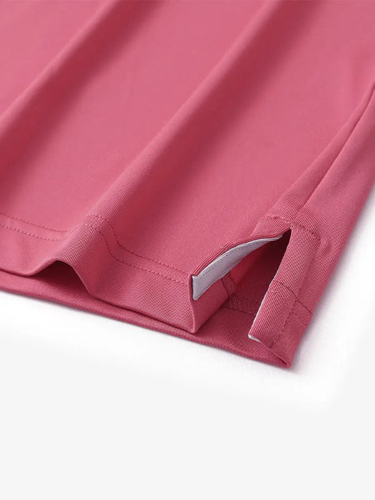 Close-up of side slit detail on CRANBERRY Chest Print Polo Shirts