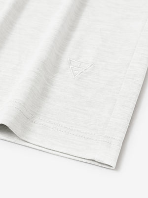 Hem detail of Men’s Long Sleeve Mock Turtleneck Shirt in White, showcasing smooth finish.