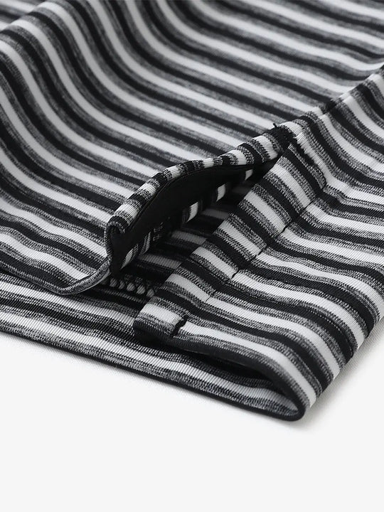 Close-up detail of hem opening on Sport Fit Stripe Polo in Black Stripe