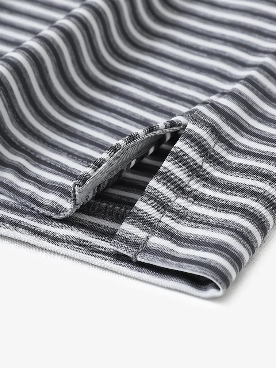 Close-up detail of hem opening on Sport Fit Stripe Polo in Dark Grey Stripe